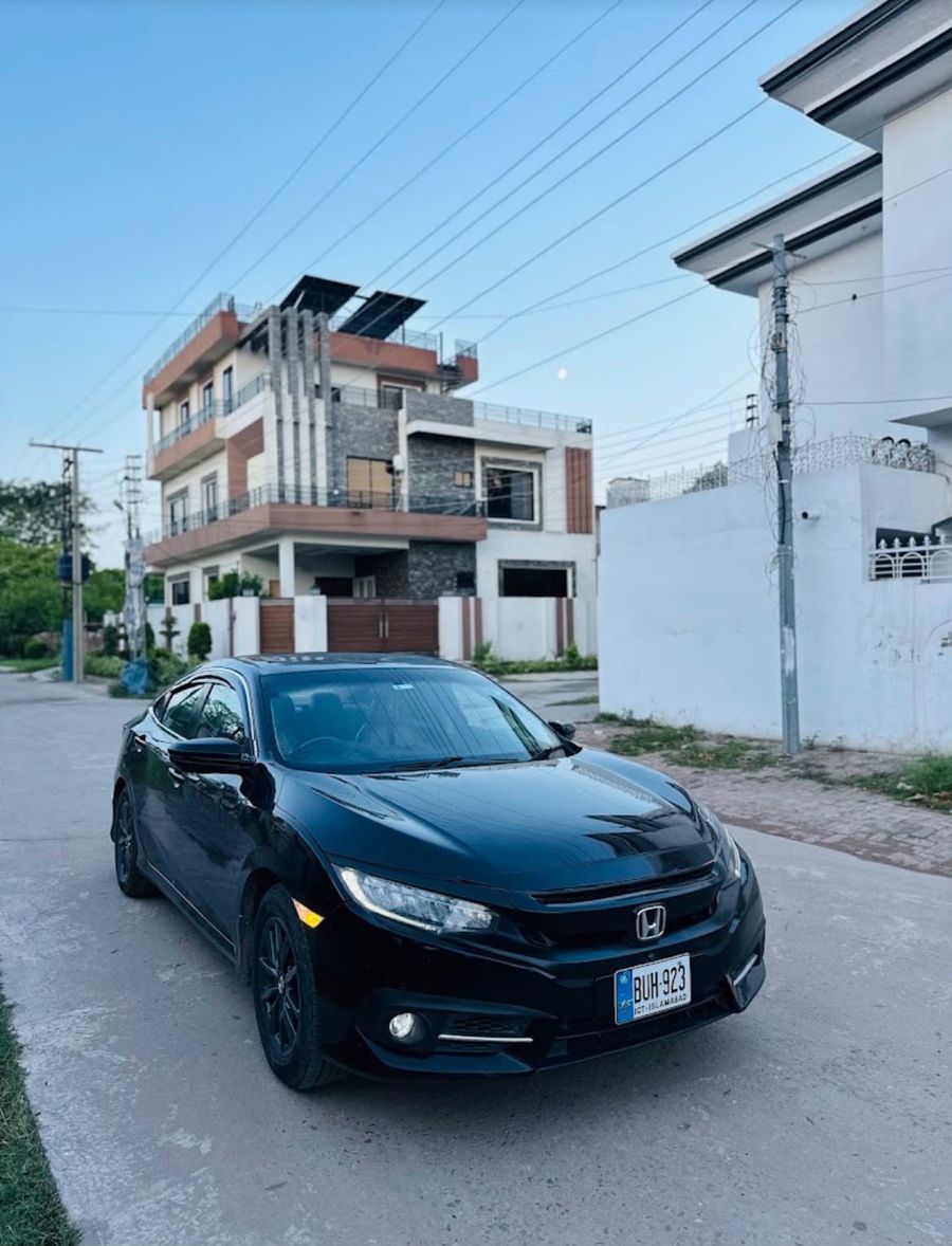 Black Honda Civic parked on a street in Gujrat