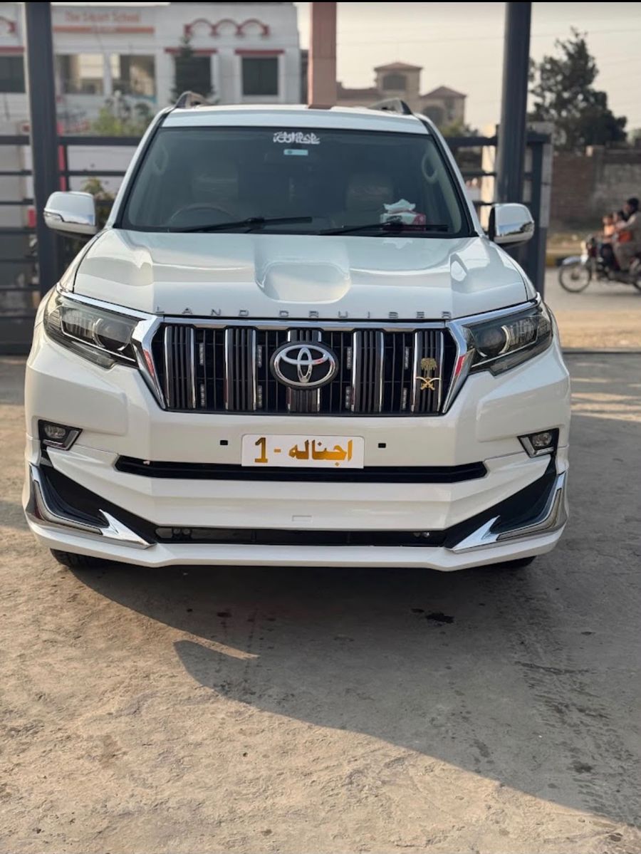White Toyota Prado available for rent at Gujjar Motors, Gujrat